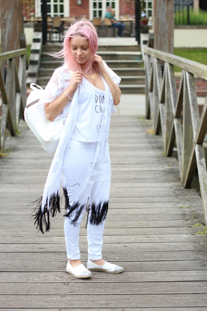 pastel pink hair girl with white backpack