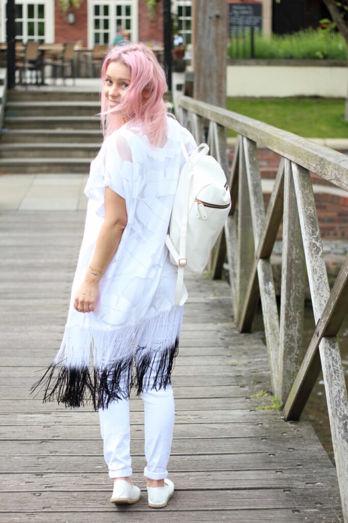 pastel pink hair girl with white backpack